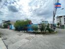 Vacant urban land with buildings in background