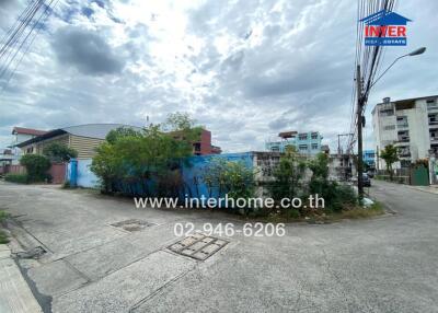 Vacant urban land with buildings in background