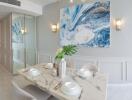 Elegant dining room with marble table and contemporary art