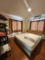 Cozy bedroom with wooden furniture and natural lighting