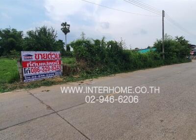 Outdoor street view with real estate for sale sign