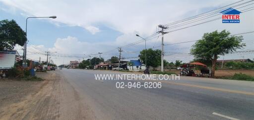 Street view outside the property showing road and neighborhood commercial area