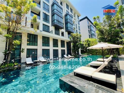 Luxurious apartment building with beautiful swimming pool and sun loungers