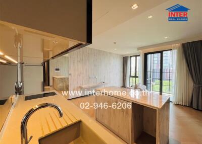 Modern kitchen with a spacious layout featuring an island and ample natural light