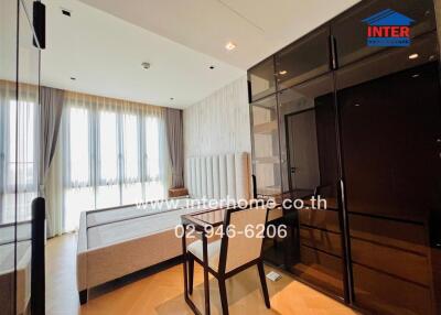 Modern bedroom with large windows and elegant interior design