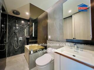 Modern bathroom with marble tiles and stylish fixtures