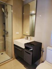 Modern bathroom interior with glass shower and stylish sink