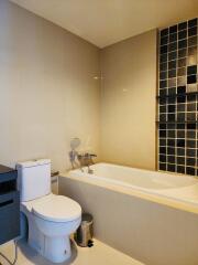 Modern bathroom with bathtub and toilet