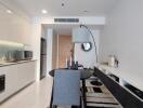 Modern kitchen with integrated appliances and dining area