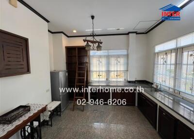 Spacious kitchen with modern appliances and ample natural light