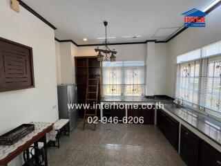 Spacious kitchen with modern appliances and ample natural light