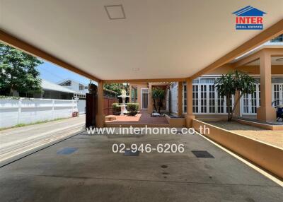 Spacious covered carport adjacent to a residential property