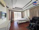 Spacious bedroom with modern amenities and ample natural light