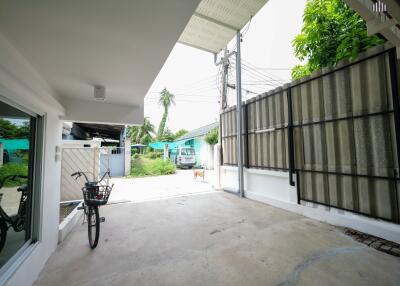 Garage with bike and driveway