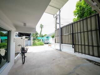 Garage with bike and driveway