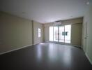 Spacious empty living room with large window