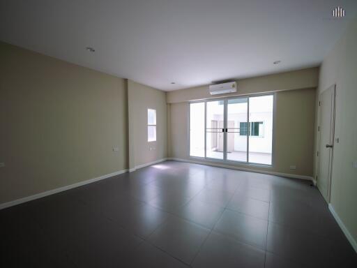 Spacious empty living room with large window