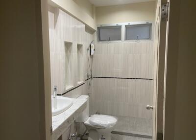 modern bathroom with tiled walls and shower