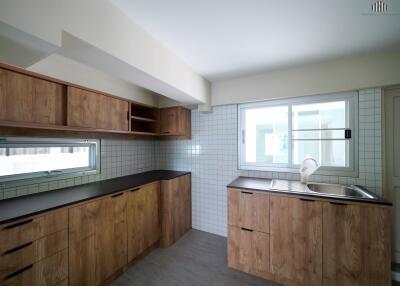 Modern kitchen with wooden cabinetry and minimalist design