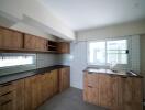 Modern kitchen with wooden cabinetry and minimalist design