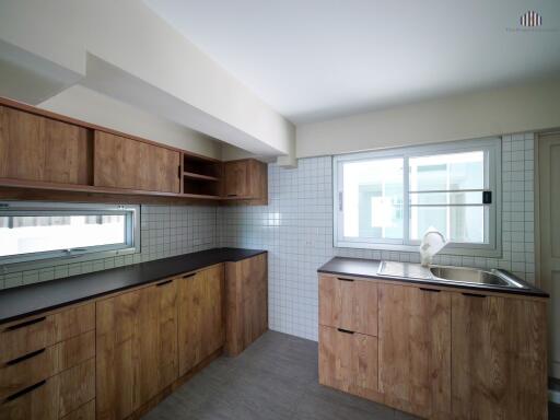 Modern kitchen with wooden cabinetry and minimalist design