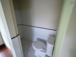 Bathroom with toilet and tiled shower area