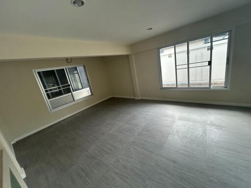 Spacious living room with large windows