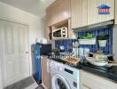 Compact modern kitchen with blue tile backsplash and integrated appliances