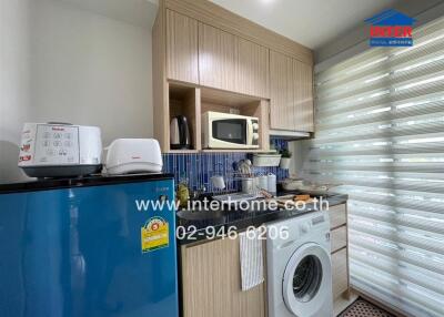 Modern kitchen with wood cabinets and blue counters