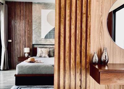 Contemporary bedroom with modern wooden furniture and art decor