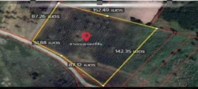 Aerial view of a rectangular land plot with boundary measurements