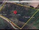 Aerial view of a rectangular land plot with boundary measurements