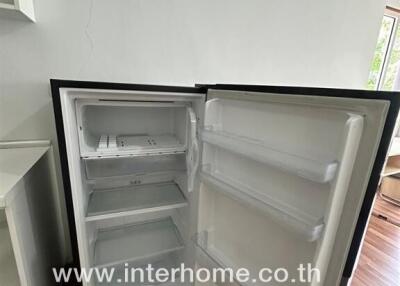 Open empty refrigerator in a modern kitchen