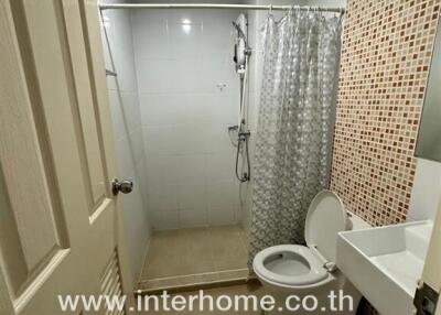 Modern bathroom interior with a shower and toilet