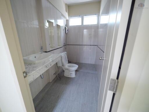 Modern bathroom with large sink and natural light