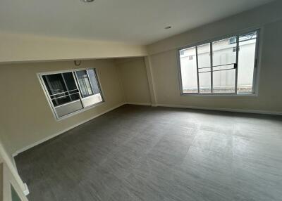 Spacious living room with large windows