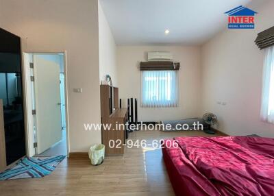 Spacious bedroom with modern amenities and natural light