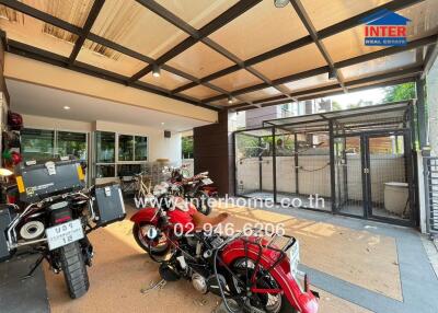 Spacious garage with multiple motorcycle parking and secure fencing