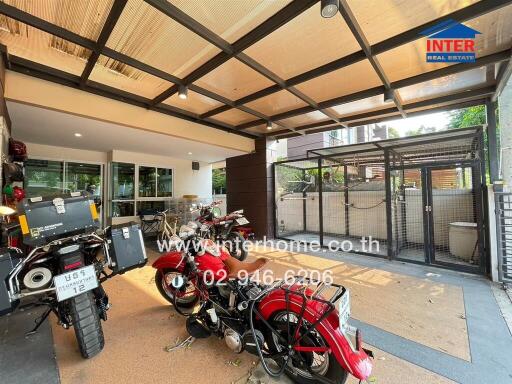 Spacious garage with multiple motorcycle parking and secure fencing