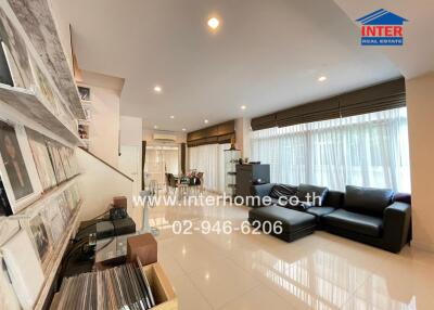 Spacious and modern living room with integrated dining area and kitchen
