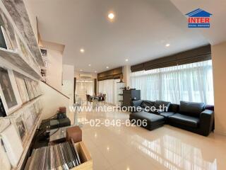 Spacious and modern living room with integrated dining area and kitchen