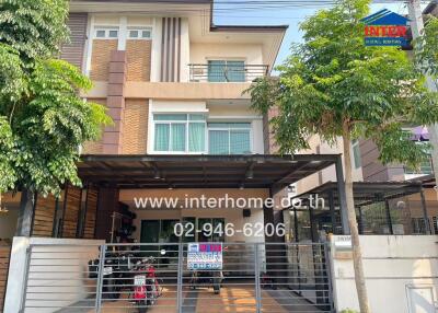 Modern two-story house with carport and balcony