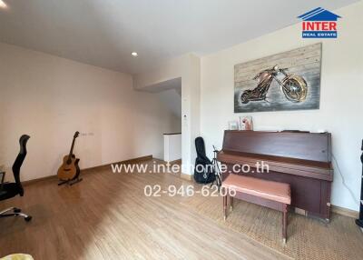 Spacious living room with musical instruments and modern decor