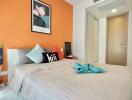 Modern bedroom with decorative elements and bright color scheme