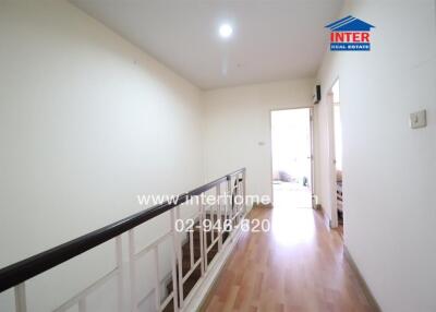 Spacious and well-lit hallway leading to a room, ideal for property ad cover