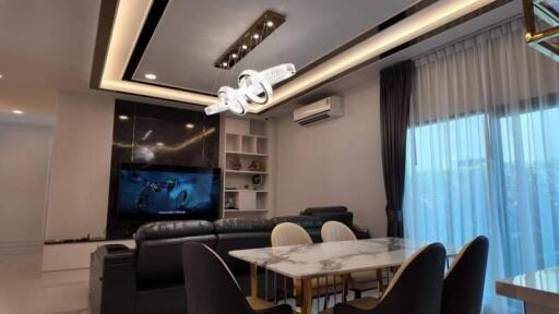 Modern living room interior with integrated dining area