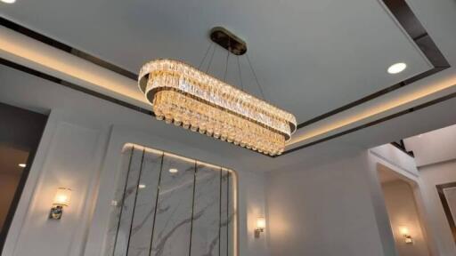 Elegant interior design of a living space with a modern chandelier and high-end finishes