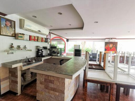 Spacious modern kitchen with ample countertop space and natural lighting