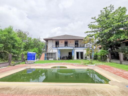 Spacious two-story house with a front yard swimming pool