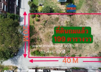 Aerial view of a vacant land plot for sale with dimensions and contact information
